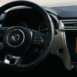 Rent MG 5 Black full option in Dubai Interior only steering