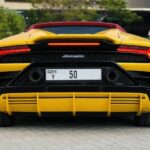 Rent Lamborghini Huracan Convertible in Dubai backside yellow
