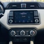 Rent Nissan Sunny in Dubai - center console