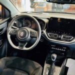 Rent Suzuki Baleno 2026 in Dubai from Amex Car Rental Interior Driving Seat View